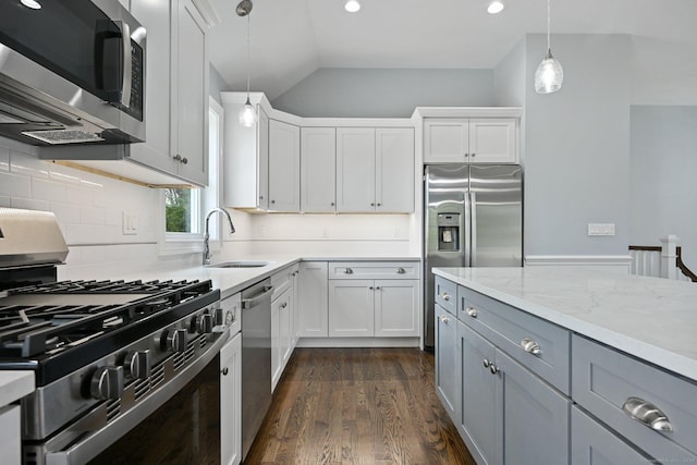 01 Sunrise Rd, Danbury, CT 06811 - kitchen featuring stainless steel appliances, gray cabinets, hanging light fixtures, tasteful backsplash, and vaulted ceiling