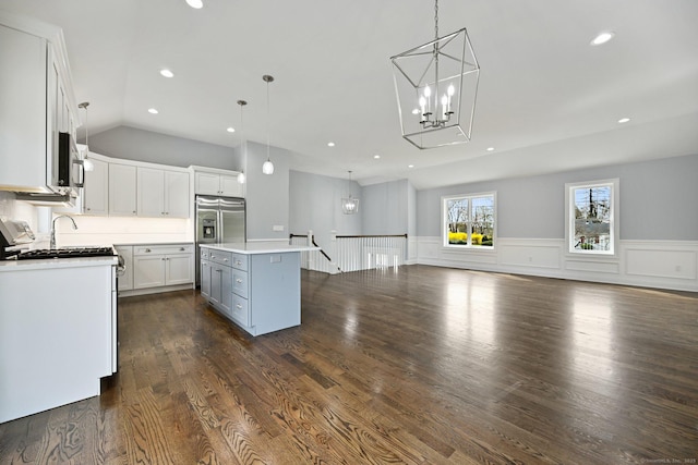 01 Sunrise Rd, Danbury, CT 06811 - kitchen featuring a chandelier, hanging light fixtures, a wainscoted wall, white cabinetry, and stainless steel appliances