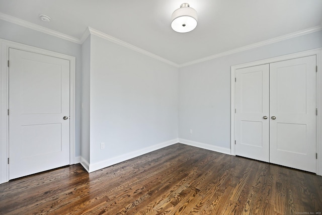 01 Sunrise Rd, Danbury, CT 06811 - unfurnished bedroom featuring dark wood-style flooring, crown molding, and a closet