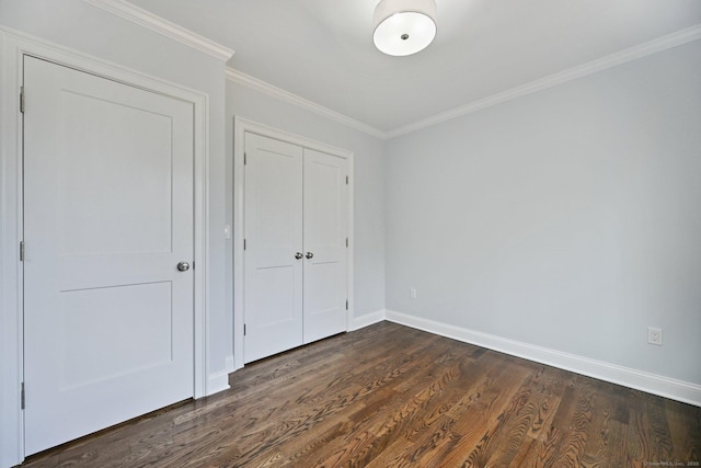 01 Sunrise Rd, Danbury, CT 06811 - unfurnished bedroom with dark wood-style floors, a closet, and ornamental molding