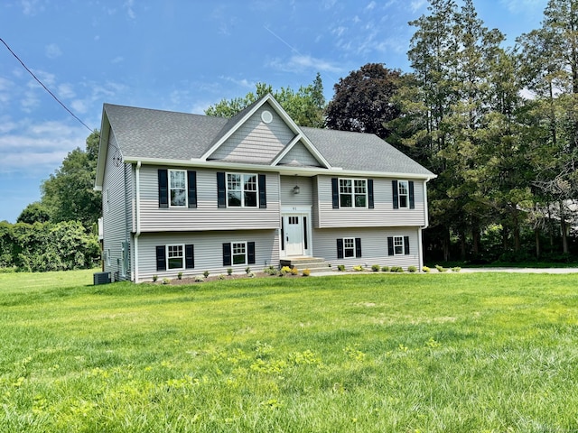 01 Sunrise Rd, Danbury, CT 06811 - split foyer home featuring a front lawn, a shingled roof, and view of scattered trees