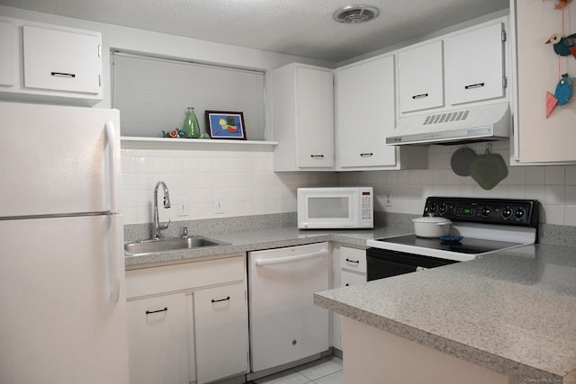 84 Shepards Knoll Dr Unit 84, Hamden, CT 06514 - kitchen with white cabinets, under cabinet range hood, backsplash, a sink, and white appliances