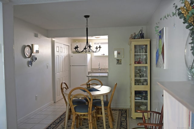 84 Shepards Knoll Dr Unit 84, Hamden, CT 06514 - dining room with baseboards, an inviting chandelier, and light tile patterned floors