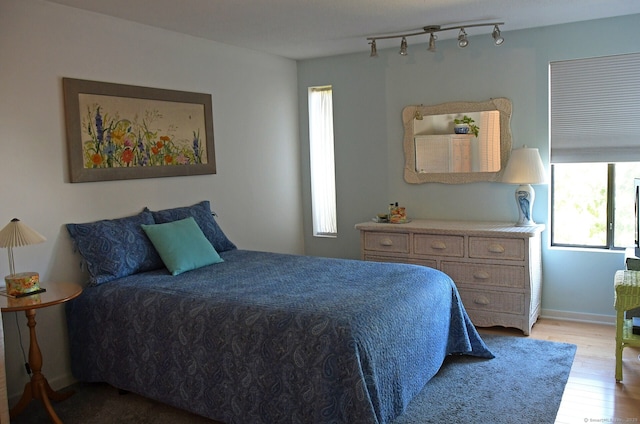 84 Shepards Knoll Dr Unit 84, Hamden, CT 06514 - bedroom featuring track lighting, baseboards, light wood-style floors, and multiple windows