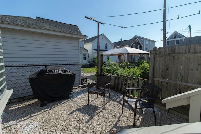 102 Broadway, Milford, CT 06460 - view of patio featuring a gazebo, fence, a residential view, and a grill