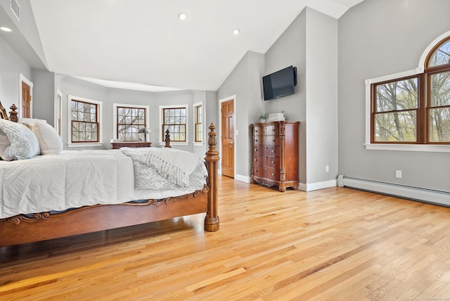bedroom with recessed lighting, a baseboard radiator, light wood-type flooring, and visible vents