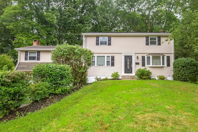 10 Belinda Ln, Enfield, CT 06082 - colonial-style house featuring entry steps, a front yard, and view of scattered trees