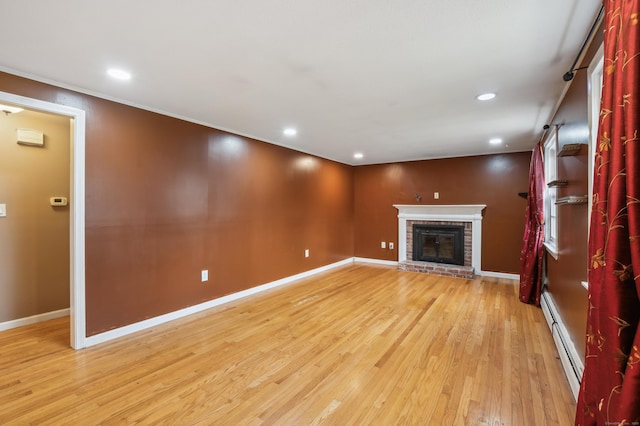 17 Fernwood Ln, Somers, CT 06071 - unfurnished living room with light wood-style flooring, baseboard heating, baseboards, recessed lighting, and a fireplace