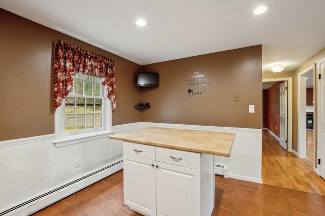 17 Fernwood Ln, Somers, CT 06071 - kitchen featuring recessed lighting, light tile patterned floors, a baseboard heating unit, light countertops, and white cabinetry