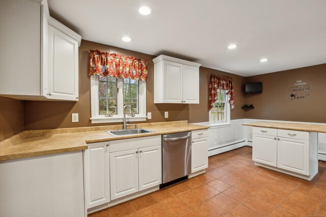 17 Fernwood Ln, Somers, CT 06071 - kitchen with a baseboard heating unit, a sink, white cabinetry, light countertops, and stainless steel dishwasher