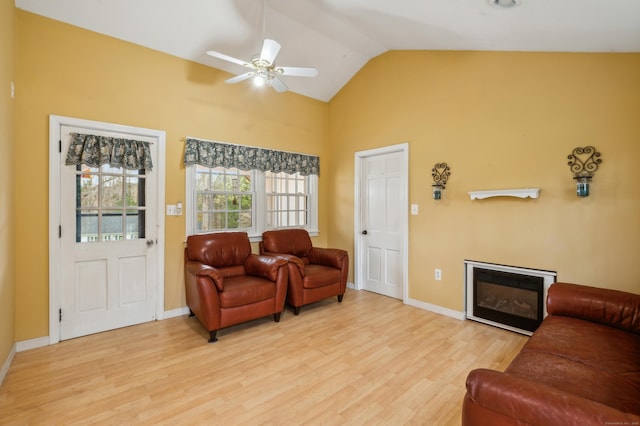 17 Fernwood Ln, Somers, CT 06071 - living room featuring baseboards, a ceiling fan, light wood-style flooring, and a glass covered fireplace