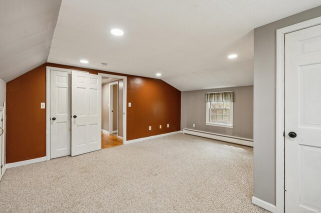 17 Fernwood Ln, Somers, CT 06071 - additional living space featuring a baseboard radiator, recessed lighting, carpet flooring, and vaulted ceiling