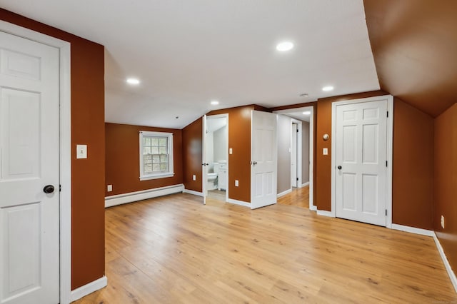 17 Fernwood Ln, Somers, CT 06071 - additional living space with baseboards, a baseboard heating unit, and light wood-style flooring