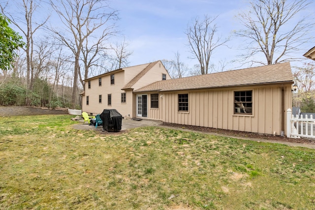 17 Fernwood Ln, Somers, CT 06071 - rear view of house featuring a patio, fence, board and batten siding, and a yard