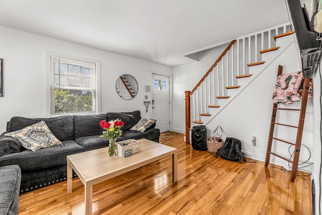 living room with stairway and light wood finished floors