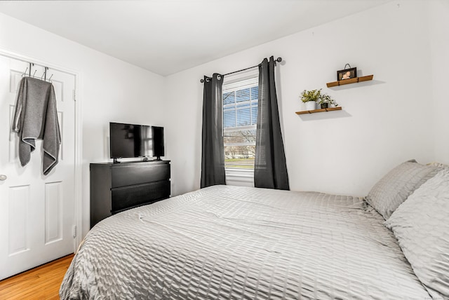 bedroom featuring wood finished floors