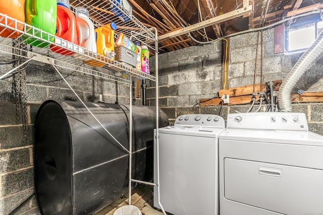 laundry area with washing machine and dryer, laundry area, and heating fuel