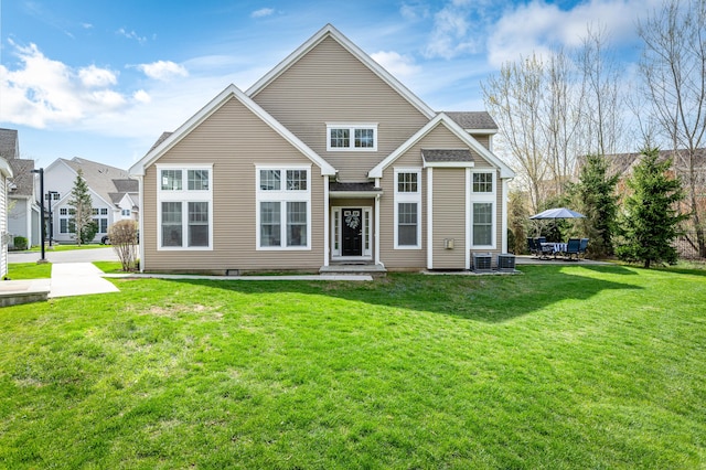 back of house with a lawn