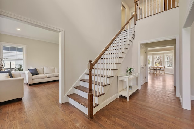 52 Morningside Dr, Greenwich, CT 06830 - stairway featuring plenty of natural light, wood finished floors, a towering ceiling, and recessed lighting
