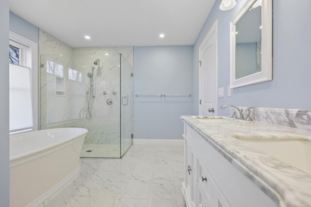52 Morningside Dr, Greenwich, CT 06830 - bathroom with marble finish floors, a marble finish shower, double vanity, recessed lighting, and a soaking tub