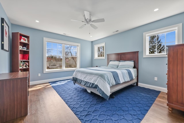 52 Morningside Dr, Greenwich, CT 06830 - bedroom with multiple windows, wood finished floors, recessed lighting, and ceiling fan