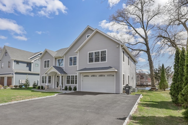 52 Morningside Dr, Greenwich, CT 06830 - view of front of property featuring a garage, driveway, and a front yard