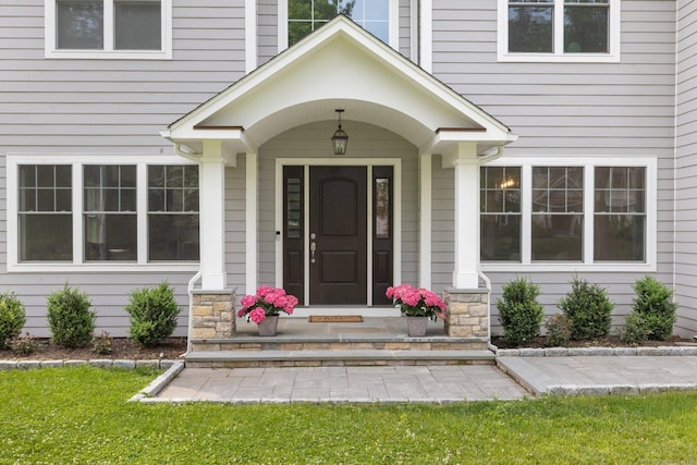 52 Morningside Dr, Greenwich, CT 06830 - view of exterior entry with stone siding and a yard