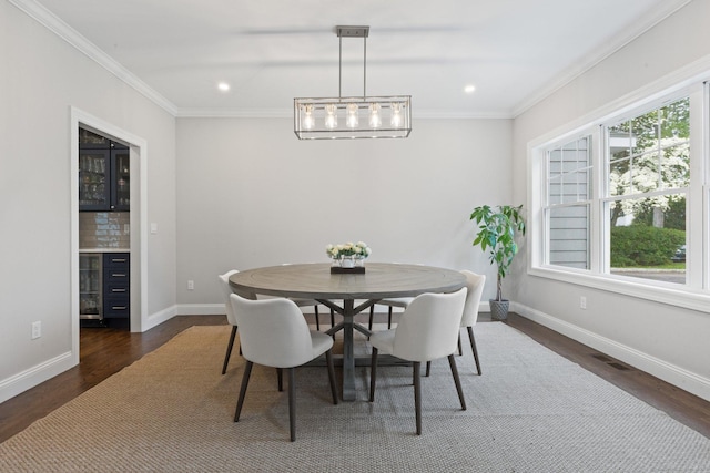 52 Morningside Dr, Greenwich, CT 06830 - dining space with dark wood finished floors, ornamental molding, recessed lighting, and a dry bar