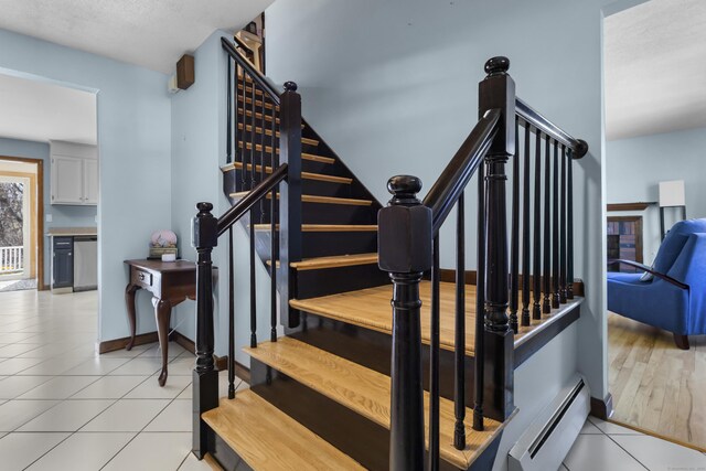 87 Summit St, Newington, CT 06111 - staircase with a baseboard radiator, tile patterned flooring, and baseboards