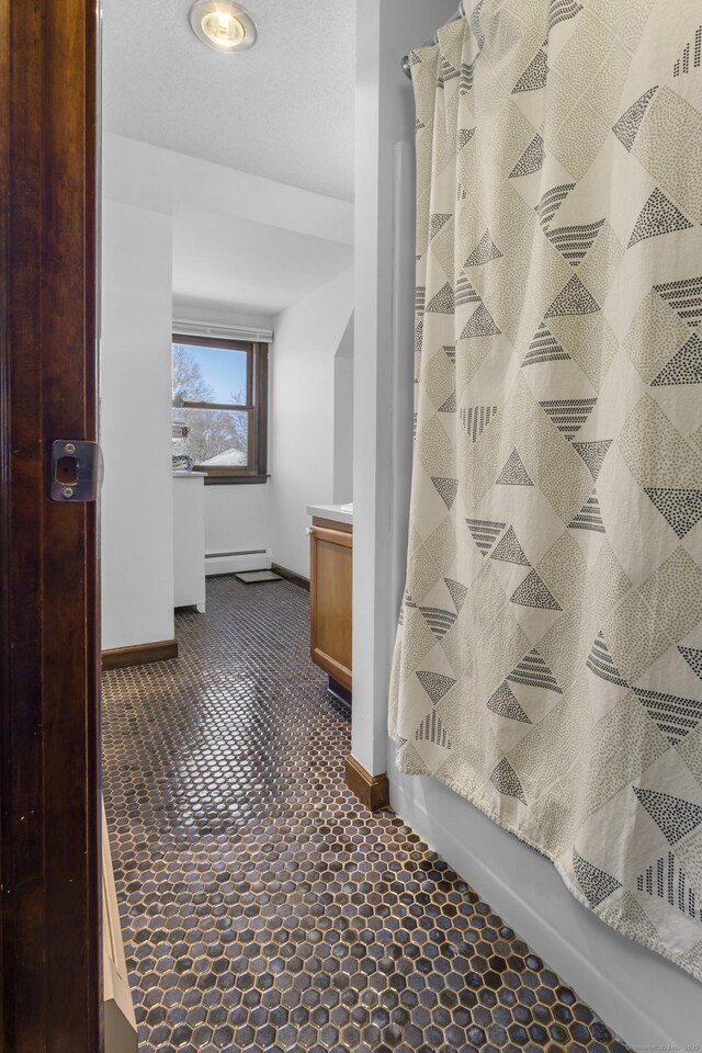 87 Summit St, Newington, CT 06111 - hall with a baseboard heating unit and baseboards