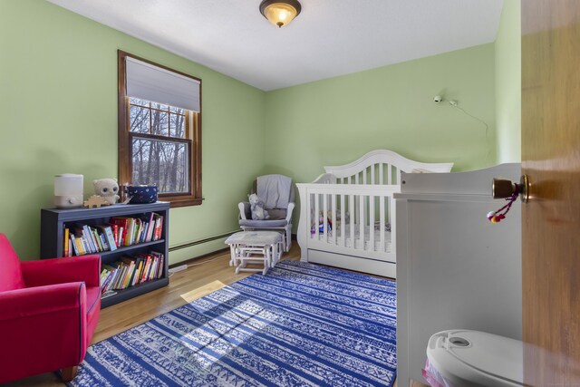 87 Summit St, Newington, CT 06111 - bedroom with a baseboard radiator and wood finished floors