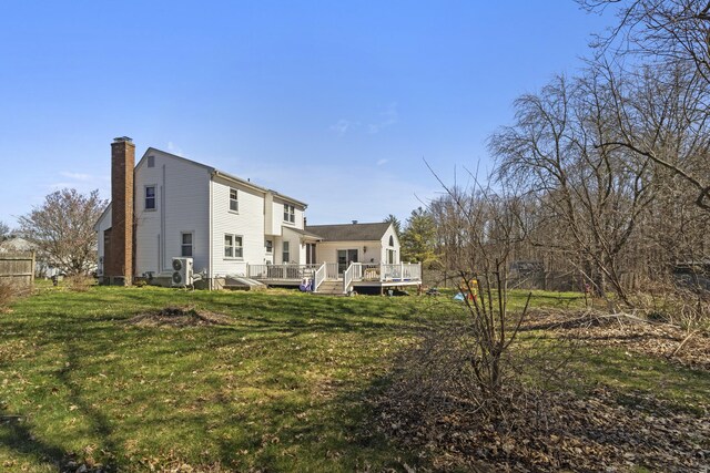 87 Summit St, Newington, CT 06111 - rear view of house with a yard, a deck, and a chimney