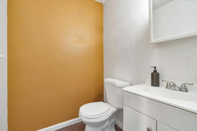 121-123 Sumac St, Waterbury, CT 06704 - half bathroom with vanity, baseboards, and toilet