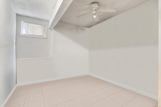 121-123 Sumac St, Waterbury, CT 06704 - basement with a textured ceiling, baseboards, ceiling fan, and light tile patterned floors