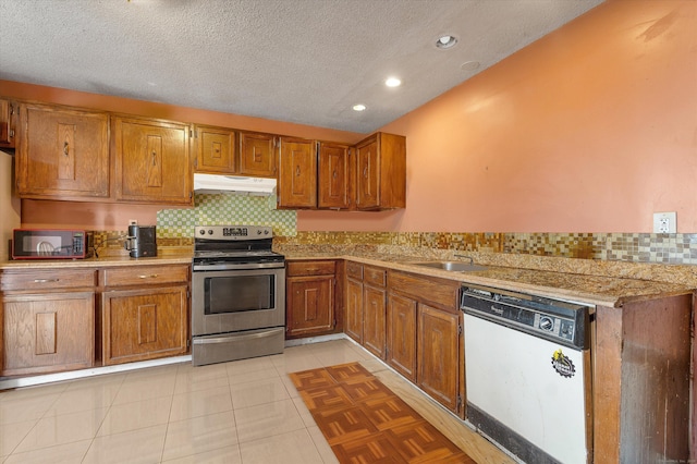121-123 Sumac St, Waterbury, CT 06704 - kitchen featuring white dishwasher, tasteful backsplash, brown cabinets, stainless steel electric range, and under cabinet range hood