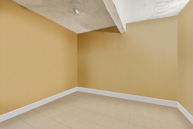 121-123 Sumac St, Waterbury, CT 06704 - unfurnished room featuring beamed ceiling, a textured ceiling, and baseboards