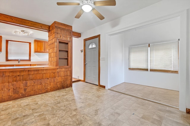interior space with a ceiling fan