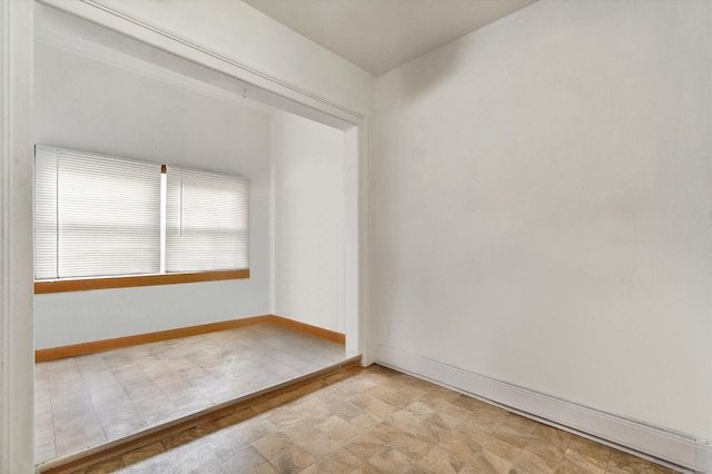 empty room with baseboards