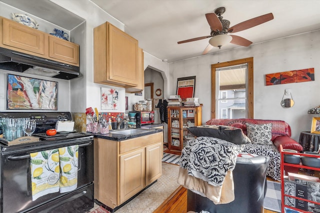 kitchen with under cabinet range hood, black electric range, ceiling fan, dark countertops, and a sink