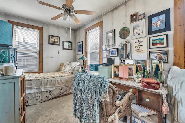 bedroom featuring multiple windows and carpet