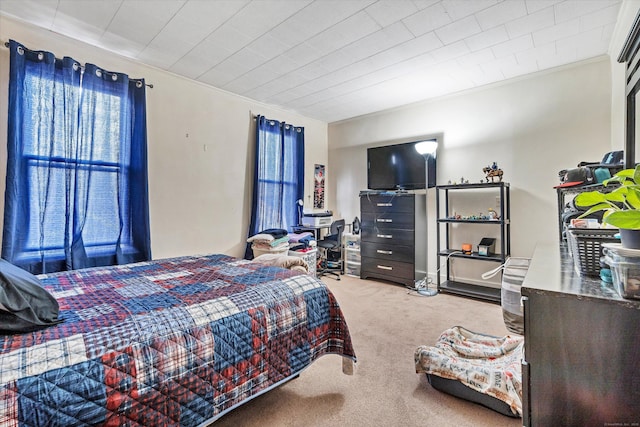 carpeted bedroom featuring crown molding