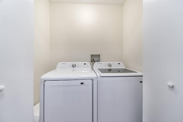 washroom featuring independent washer and dryer and laundry area