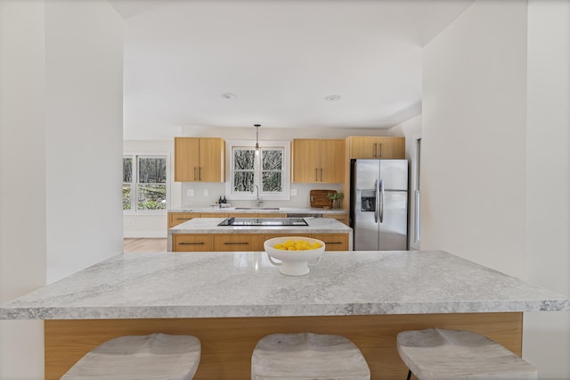 8 Goodsell Rd, Hamden, CT 06473 - kitchen featuring stainless steel fridge, a sink, black electric stovetop, a kitchen breakfast bar, and recessed lighting
