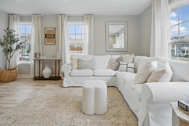 living room featuring wood finished floors and baseboards