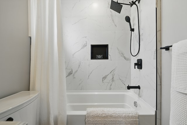 full bath featuring toilet and shower / bath combo with shower curtain