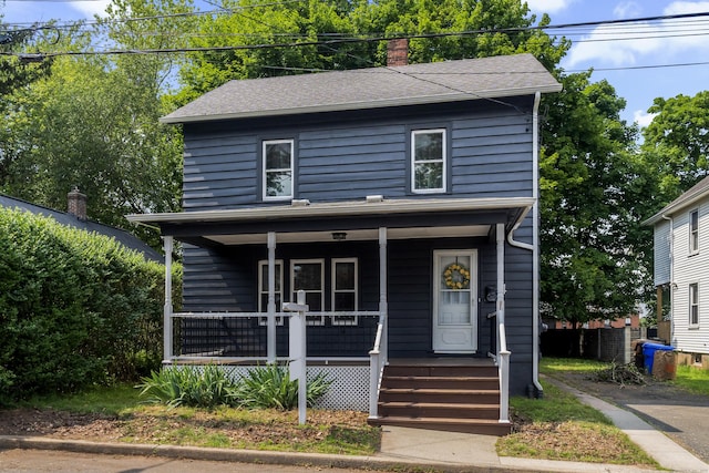 4 Glynn Ave, Middletown, CT 06457 - american foursquare style home featuring a porch, a chimney, and roof with shingles