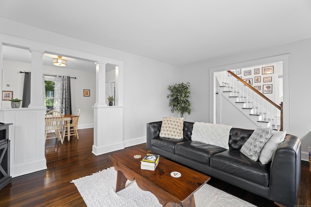 4 Glynn Ave, Middletown, CT 06457 - living area with ornate columns, wood finished floors, stairs, and baseboards