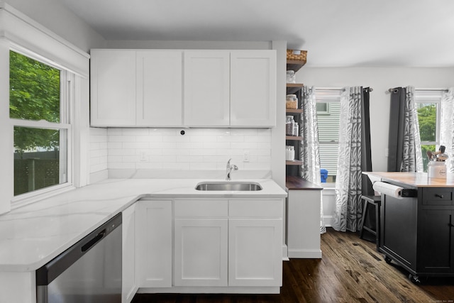 4 Glynn Ave, Middletown, CT 06457 - kitchen with stainless steel dishwasher, a sink, white cabinets, and tasteful backsplash