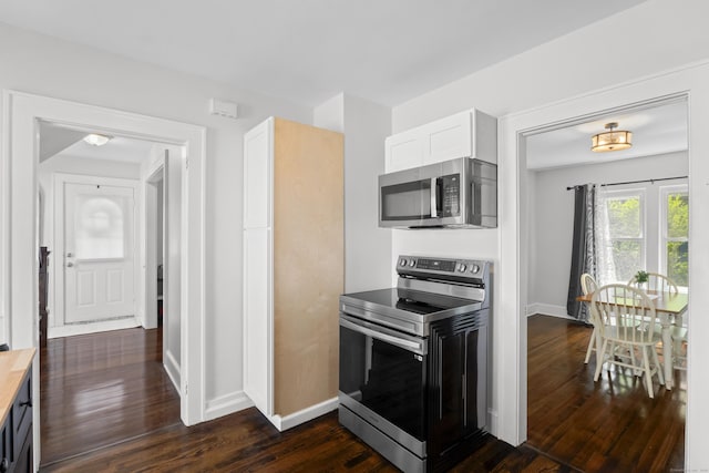 4 Glynn Ave, Middletown, CT 06457 - kitchen with appliances with stainless steel finishes, dark wood-style floors, baseboards, and white cabinetry
