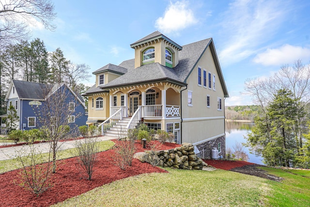 72 Indian Spring Rd, Woodstock, CT 06281 - view of front facade with a porch, stucco siding, stairway, roof with shingles, and a front lawn